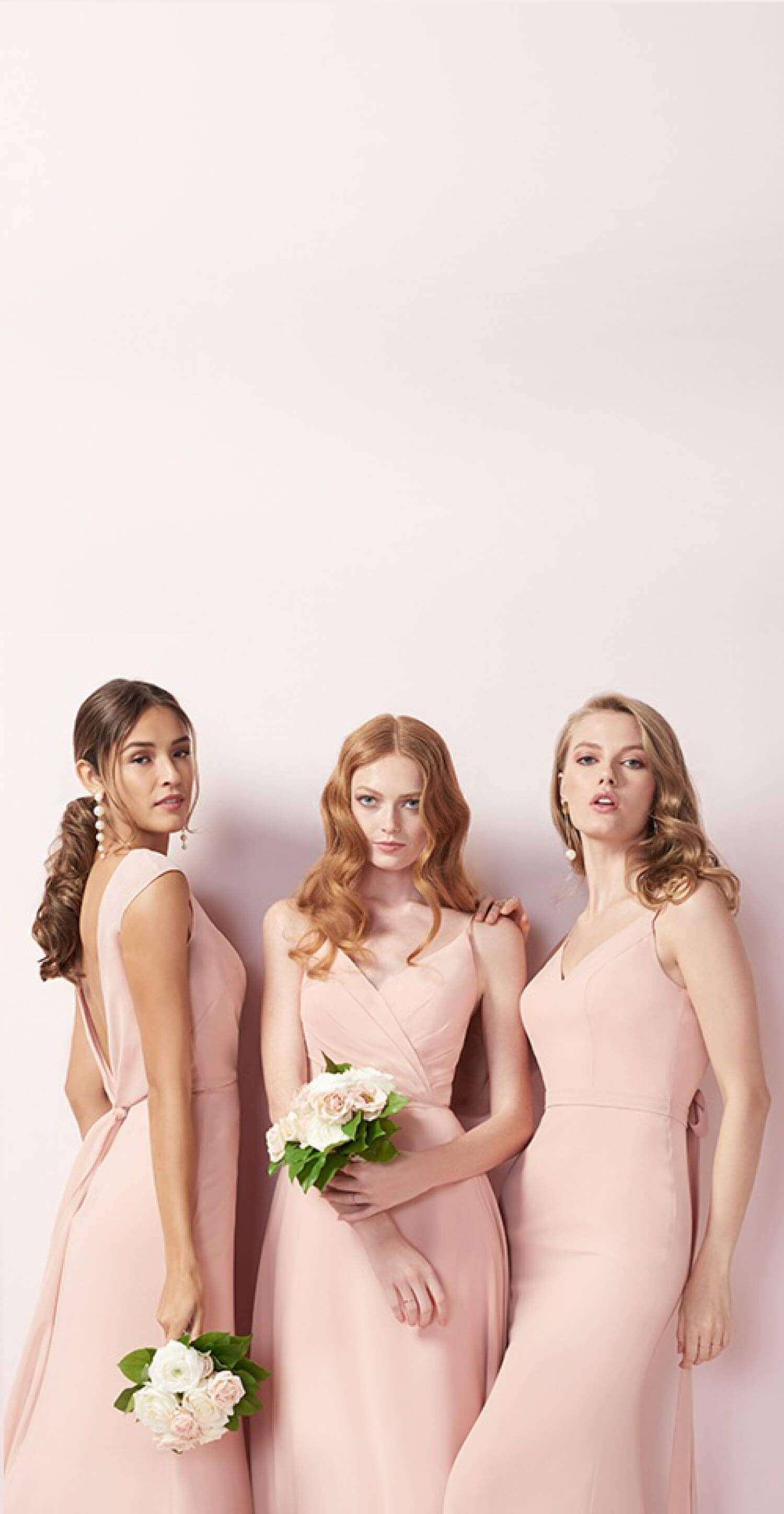 Models wearing pink dresses. Mobile Image