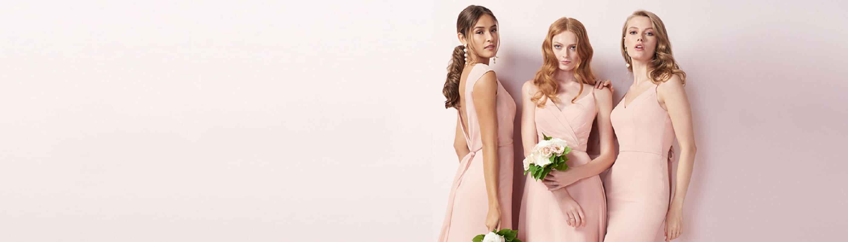 Models wearing pink dresses