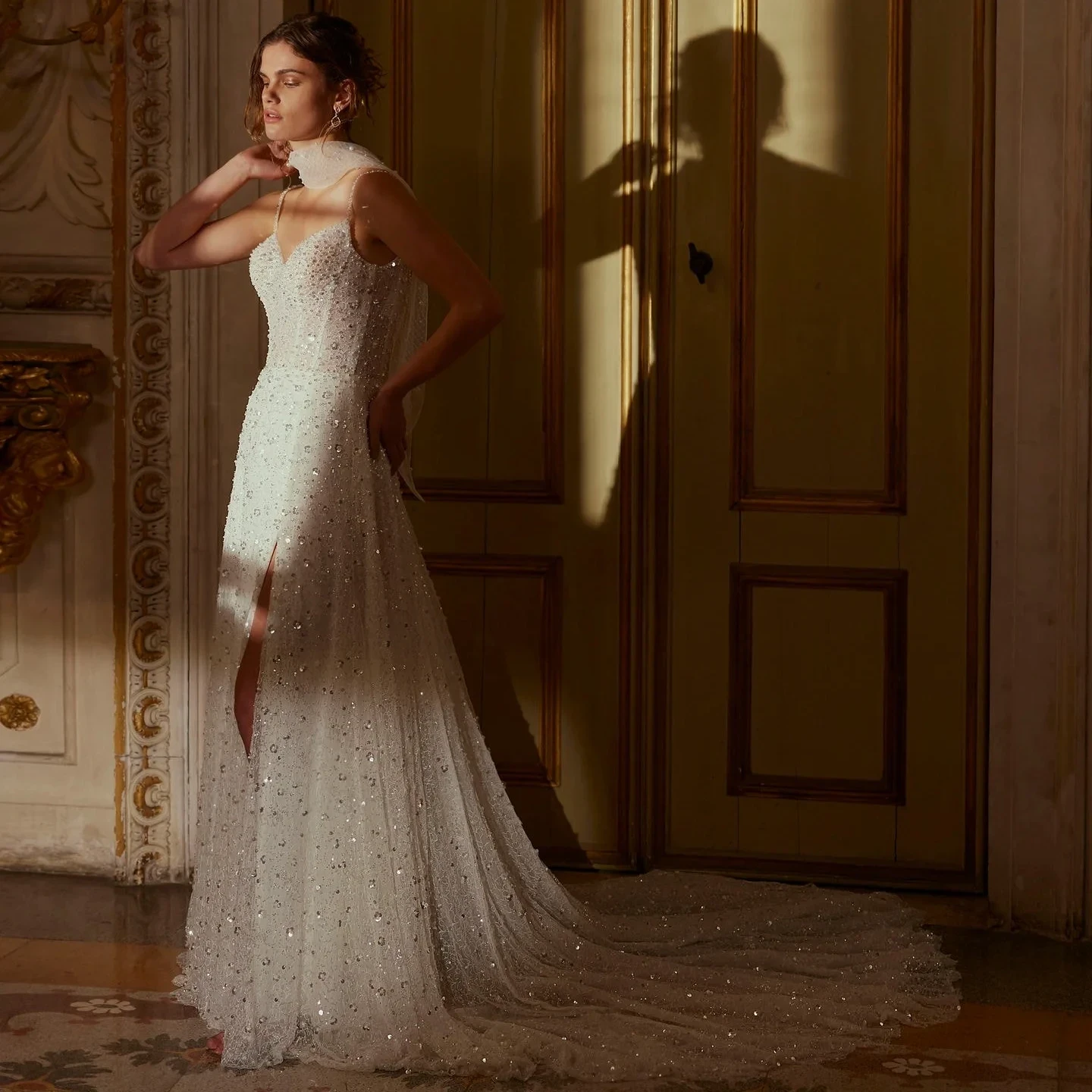 Model wearing a white gown by Demetrios