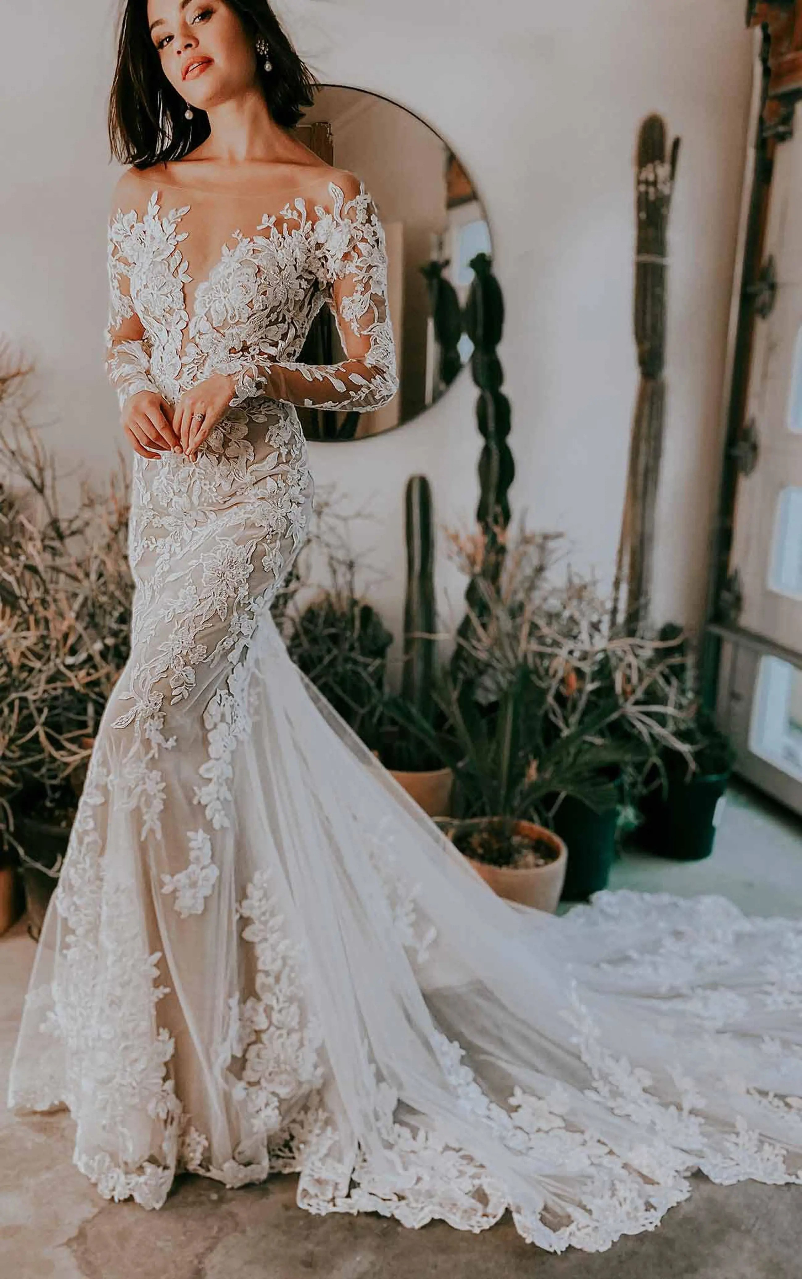 Model wearing a white gown by Essense of Australia