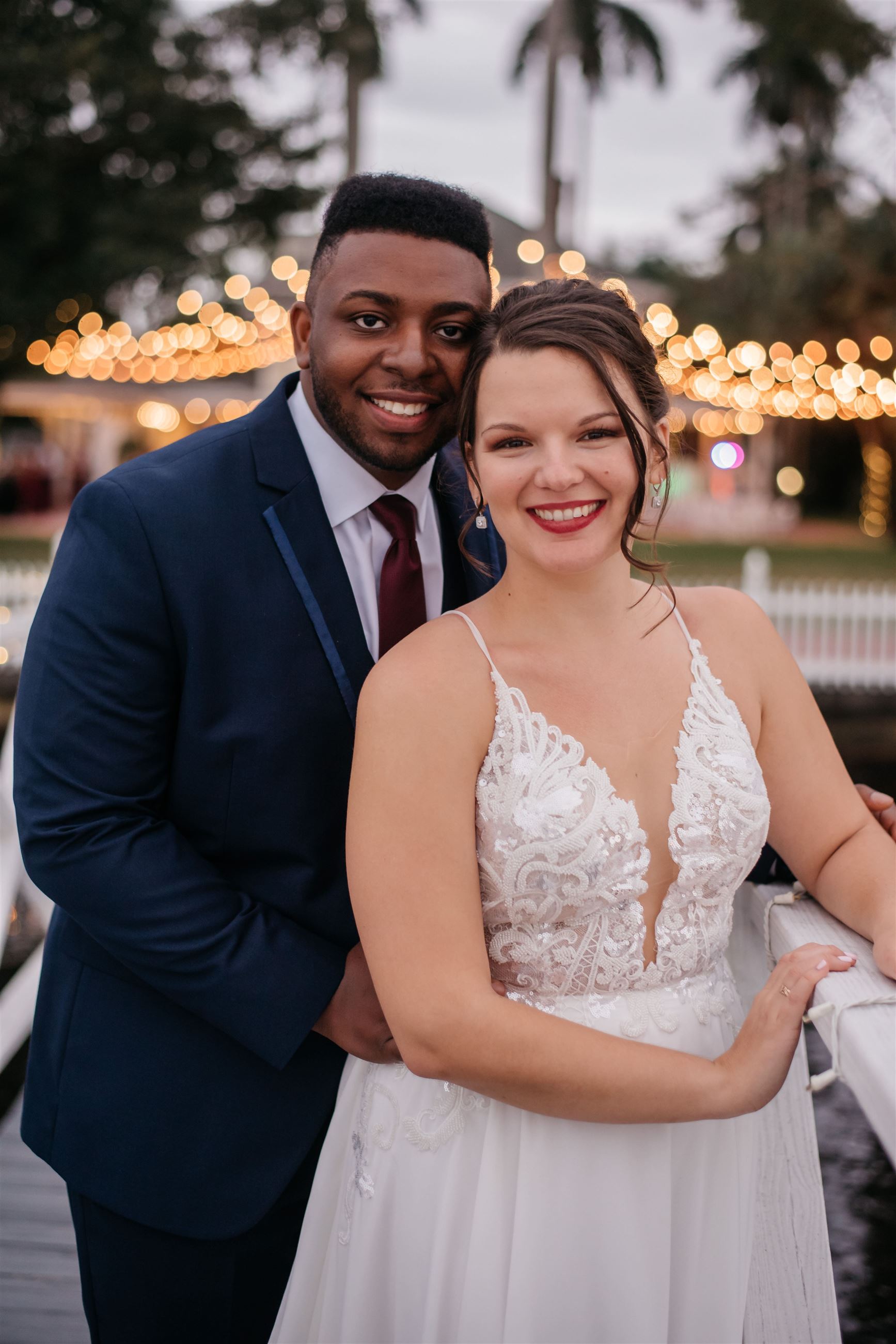 Сouple wearing a white gown and a blue suit